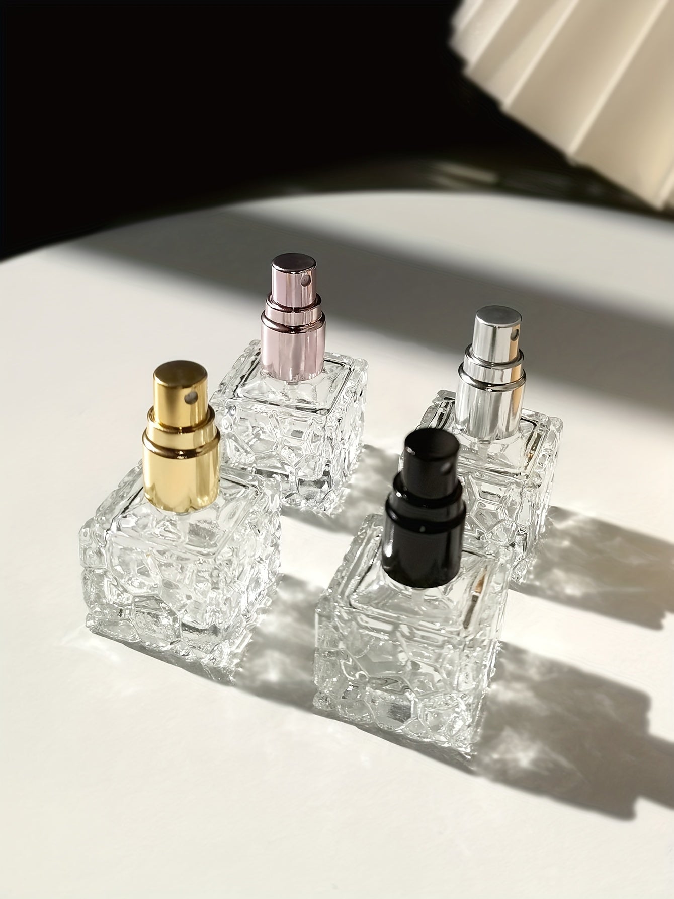 4-Pack 10ml Square Textured Glass Perfume Bottles, Portable Mini Spray Atomizer, Refillable, Travel-Friendly, with Fine Mist Sprayer, Elegant Personal Fragrance Vial, Assorted Metallic Caps